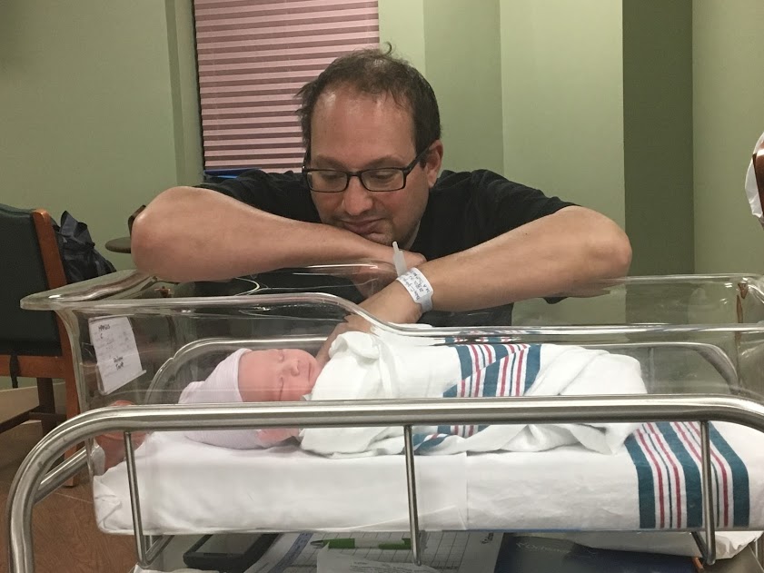 a new dad with a baby in the hospital.